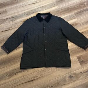 Black quilted Barbour jacket with plaid lining and corduroy collar